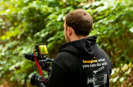 Kian with the gimbal rig, seen from behind
