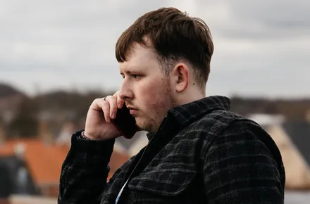 Kian on a call on location
