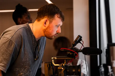Kian checking a shot on set at Vocal Venue